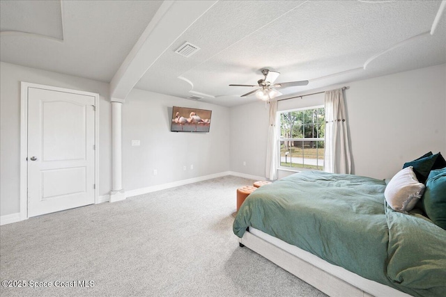 bedroom featuring ceiling fan, a textured ceiling, and carpet flooring