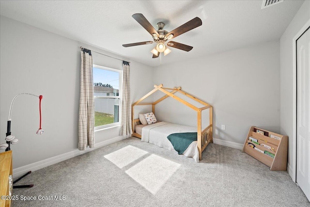 carpeted bedroom featuring ceiling fan