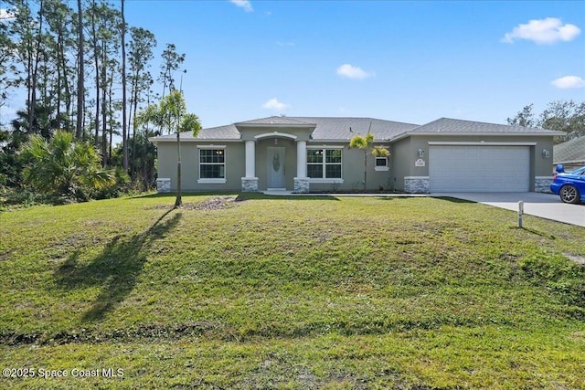 view of front of home with a garage and a front lawn