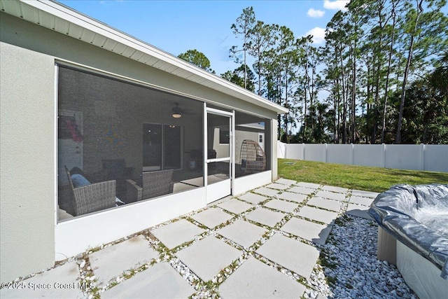 view of patio / terrace with a sunroom