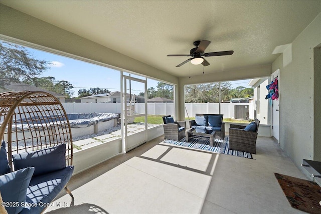 sunroom / solarium with ceiling fan