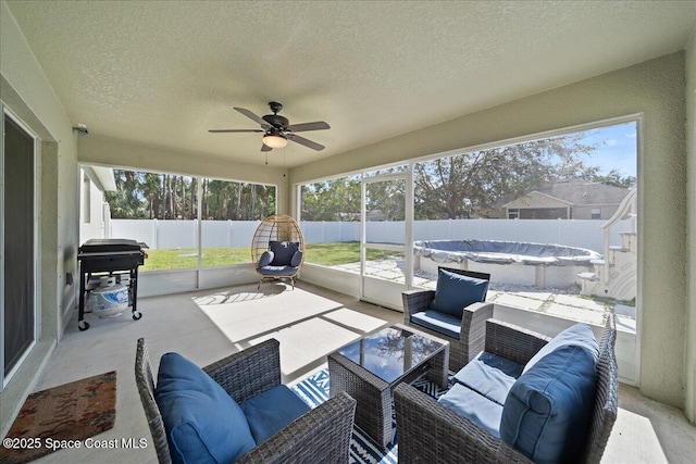 sunroom with ceiling fan