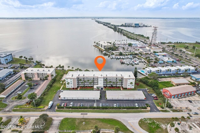 birds eye view of property with a water view