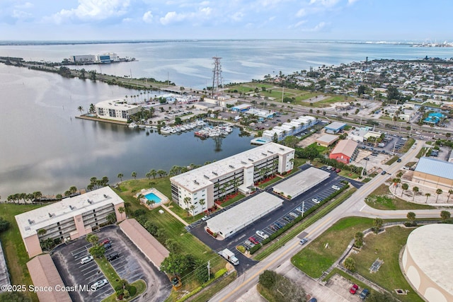 birds eye view of property with a water view