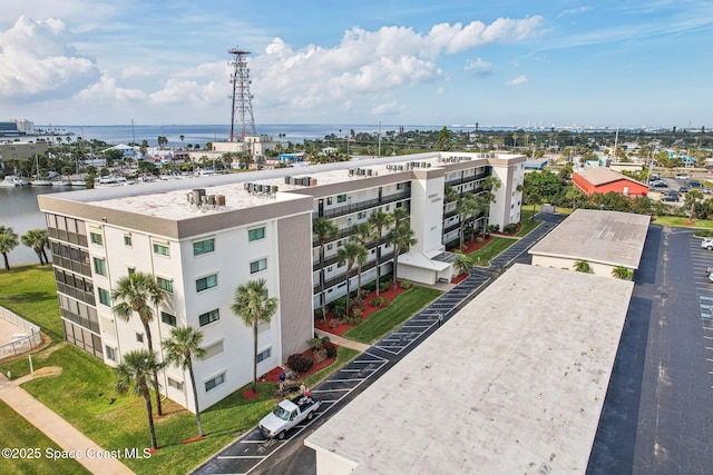 birds eye view of property with a view of city and a water view