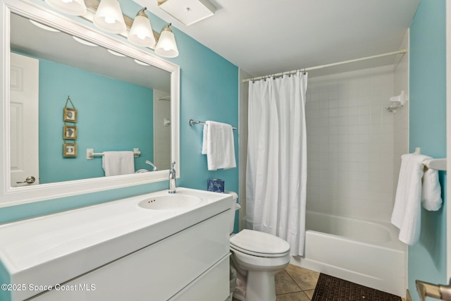 bathroom featuring tile patterned floors, toilet, vanity, and shower / bathtub combination with curtain