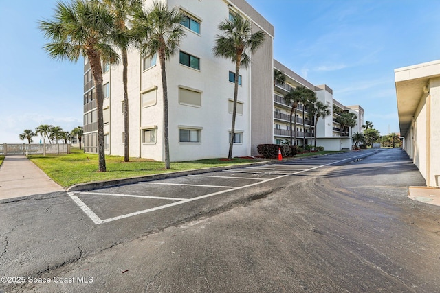 view of property with uncovered parking