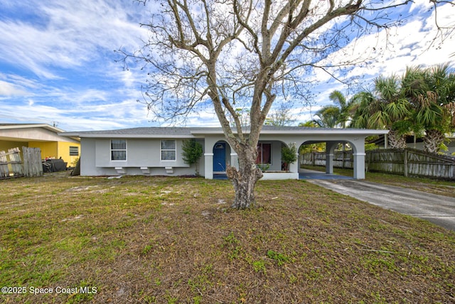 ranch-style house with a carport and a front yard