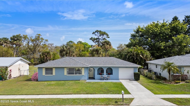 ranch-style house featuring driveway, a front lawn, fence, and stucco siding