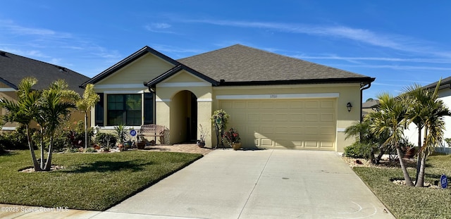 view of front of home featuring a garage and a front yard