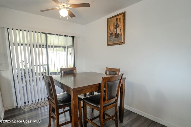 dining space featuring dark wood-type flooring and ceiling fan