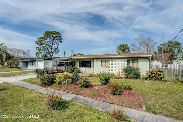 ranch-style house with a front lawn