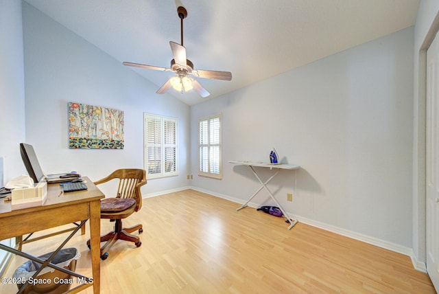 home office featuring vaulted ceiling, hardwood / wood-style floors, and ceiling fan