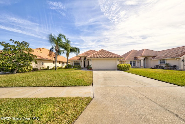 view of front of property with a garage and a front yard