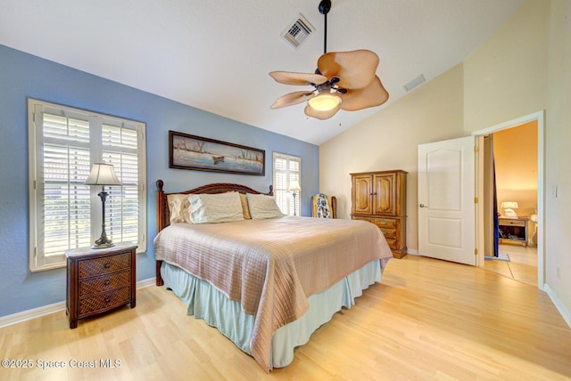 bedroom featuring vaulted ceiling, ceiling fan, and light hardwood / wood-style flooring