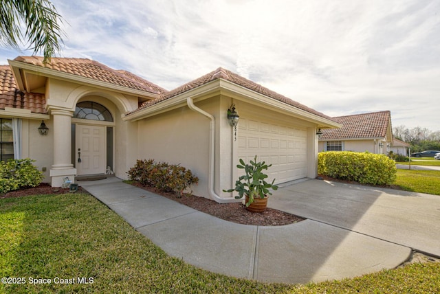 view of front of property with a garage and a front yard