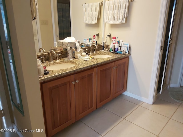 bathroom with vanity and tile patterned floors