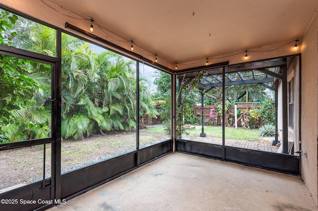 unfurnished sunroom with a wealth of natural light