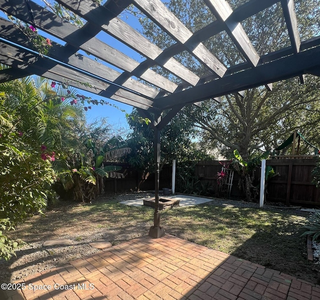 view of patio / terrace featuring a fenced backyard and a pergola