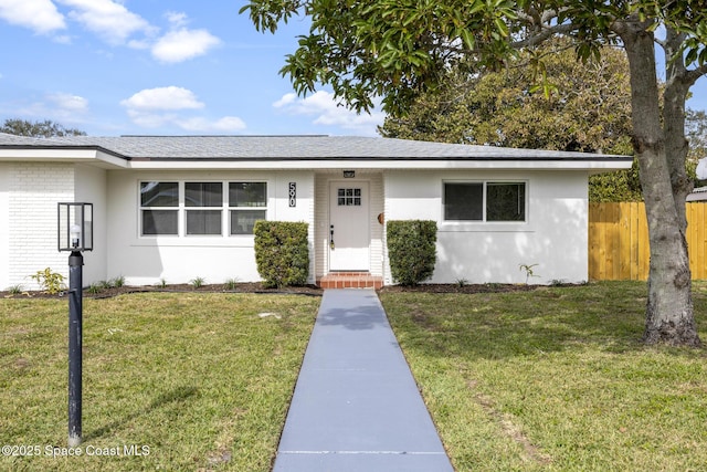 ranch-style house with a front yard