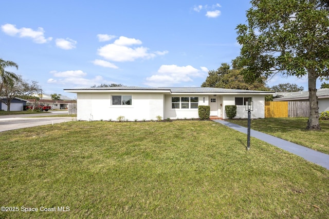 ranch-style house with a front lawn