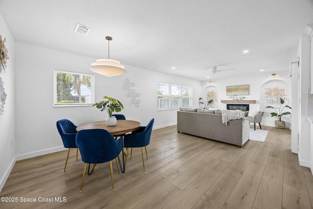 dining space with light wood-type flooring