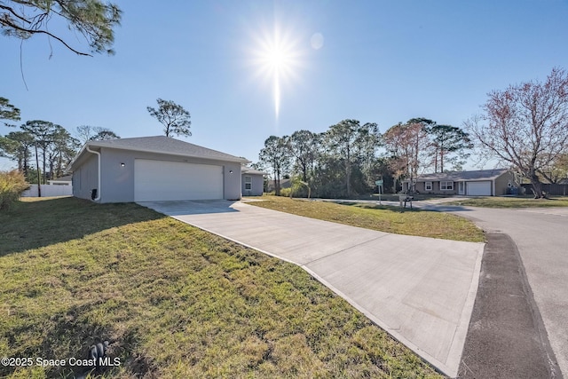 single story home with a garage and a front yard