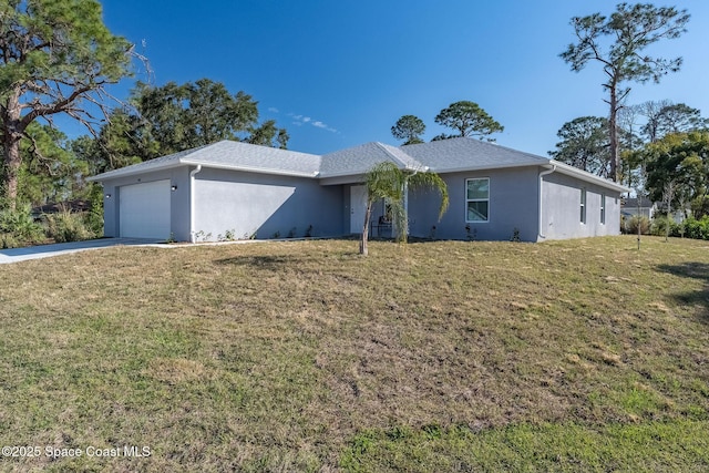 ranch-style home featuring a garage and a front lawn