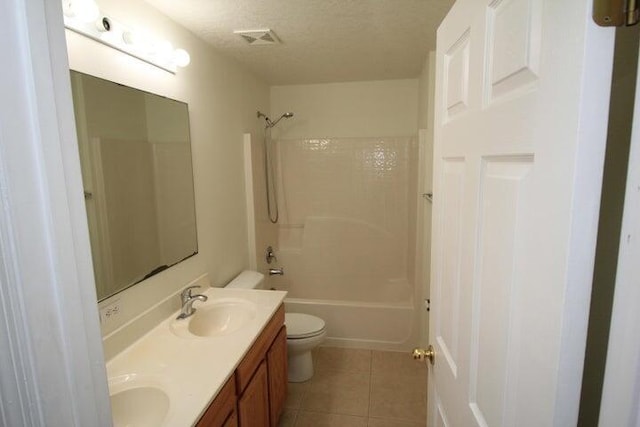 full bathroom featuring toilet, a textured ceiling, shower / tub combination, vanity, and tile patterned flooring