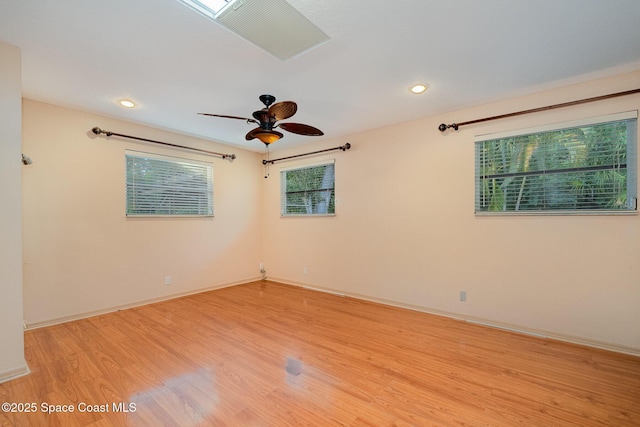 unfurnished room with ceiling fan and light hardwood / wood-style floors