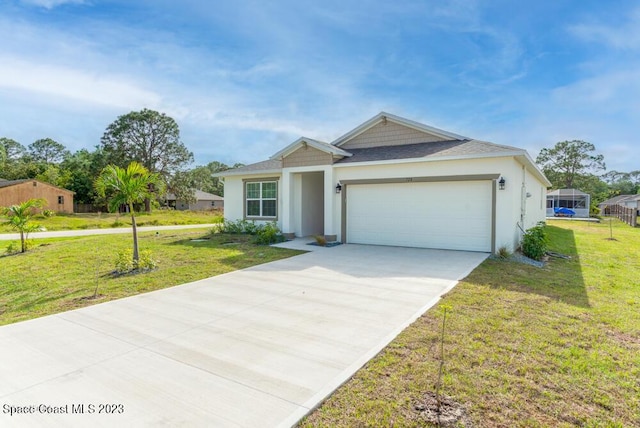 view of front of home with a garage and a front yard