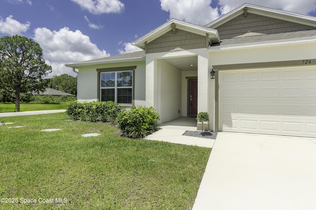 724 San Filippo Dr SE, Palm Bay, FL 32909 - view of front of property with stucco siding, a front yard, driveway, a garage, and a shingled roof