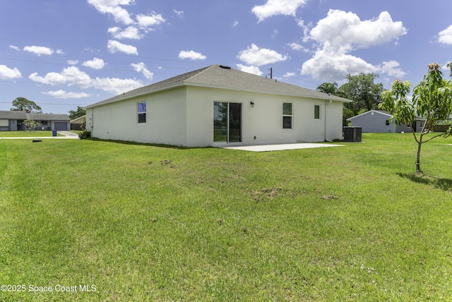 724 San Filippo Dr SE, Palm Bay, FL 32909 - back of house with stucco siding, a patio area, central air condition unit, and a yard