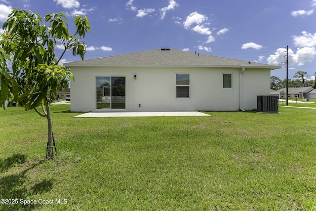 724 San Filippo Dr SE, Palm Bay, FL 32909 - rear view of house with stucco siding, a patio area, central AC, and a yard
