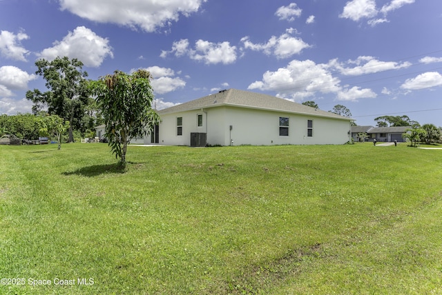 724 San Filippo Dr SE, Palm Bay, FL 32909 - view of grassy yard featuring cooling unit
