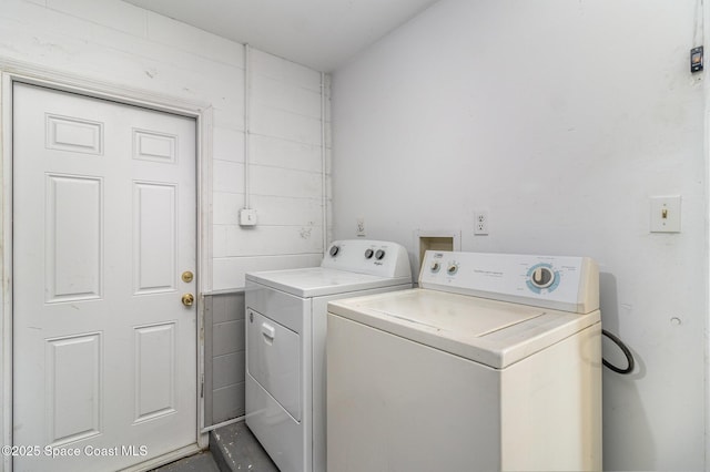 laundry room featuring laundry area and washing machine and dryer