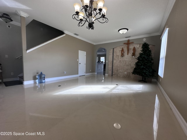 unfurnished living room with crown molding and an inviting chandelier