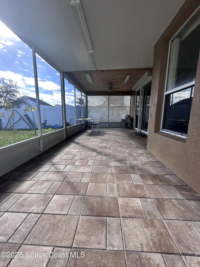 unfurnished sunroom featuring a mountain view