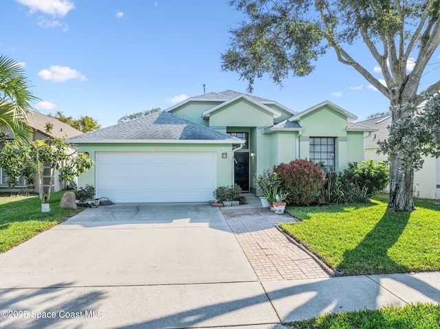 view of front of home featuring a garage and a front yard