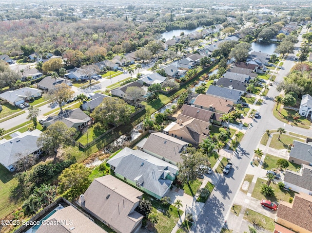 bird's eye view with a water view