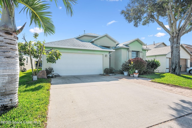 ranch-style home with a garage and a front yard