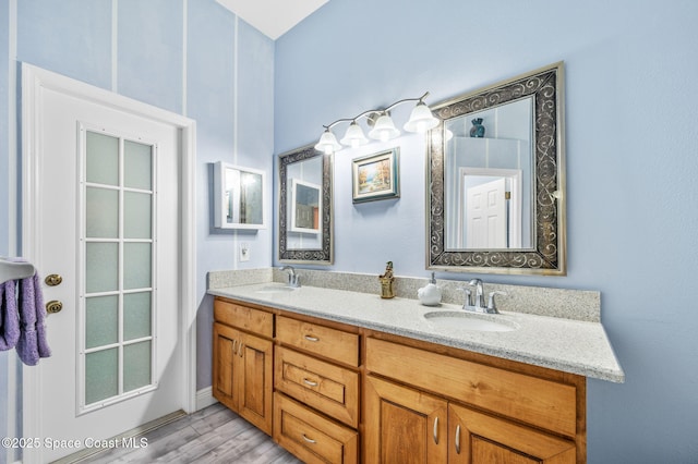 bathroom featuring vanity and hardwood / wood-style floors