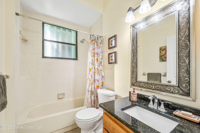 full bathroom featuring shower / bath combo, vanity, and toilet