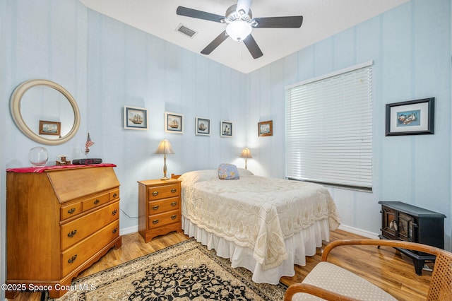 bedroom featuring ceiling fan and light wood-type flooring