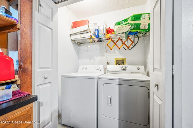 laundry area with separate washer and dryer