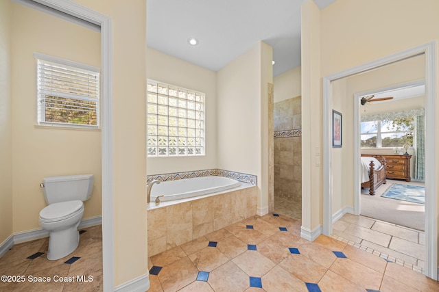 bathroom with tile patterned floors, toilet, and separate shower and tub