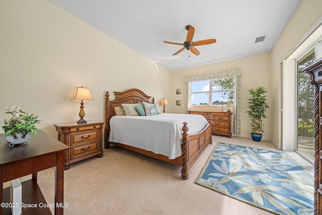 bedroom with light colored carpet, access to exterior, and ceiling fan