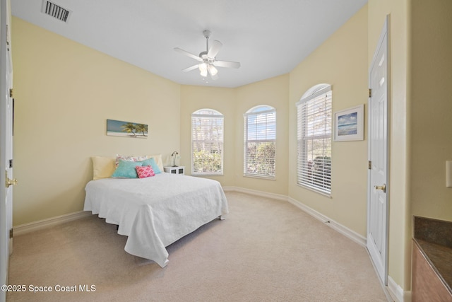 bedroom with light colored carpet and ceiling fan