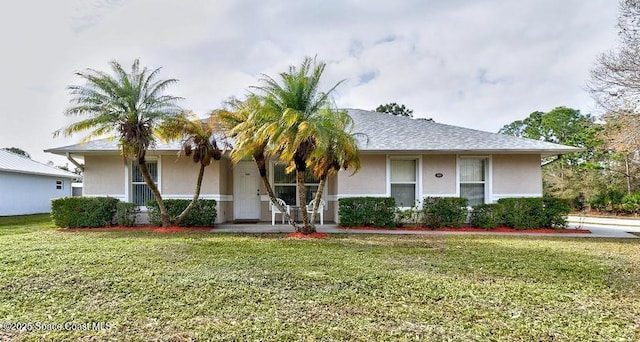 ranch-style home featuring a front yard