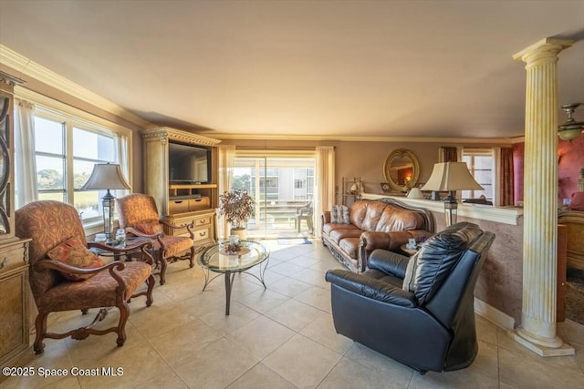 tiled living room featuring decorative columns and ornamental molding